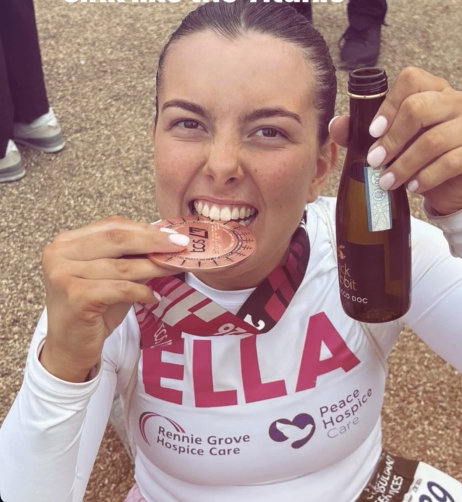Ella and her medal after completing the London Marathon in April
