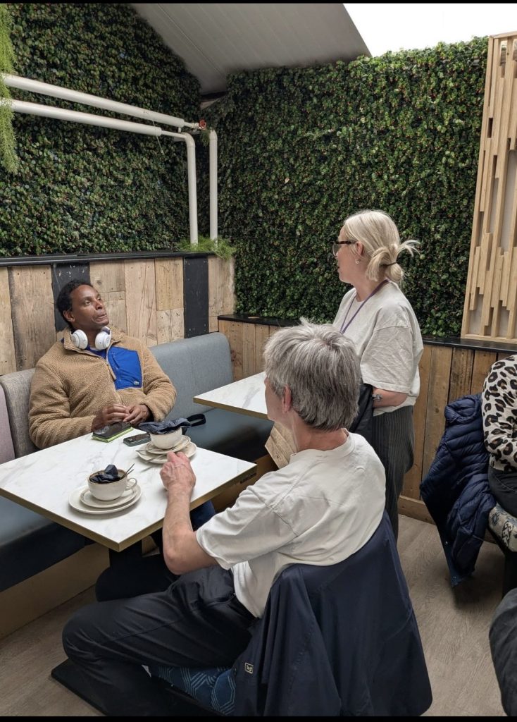 Larissa enjoying a conversation with some of the members at Flowerland in Bourne End