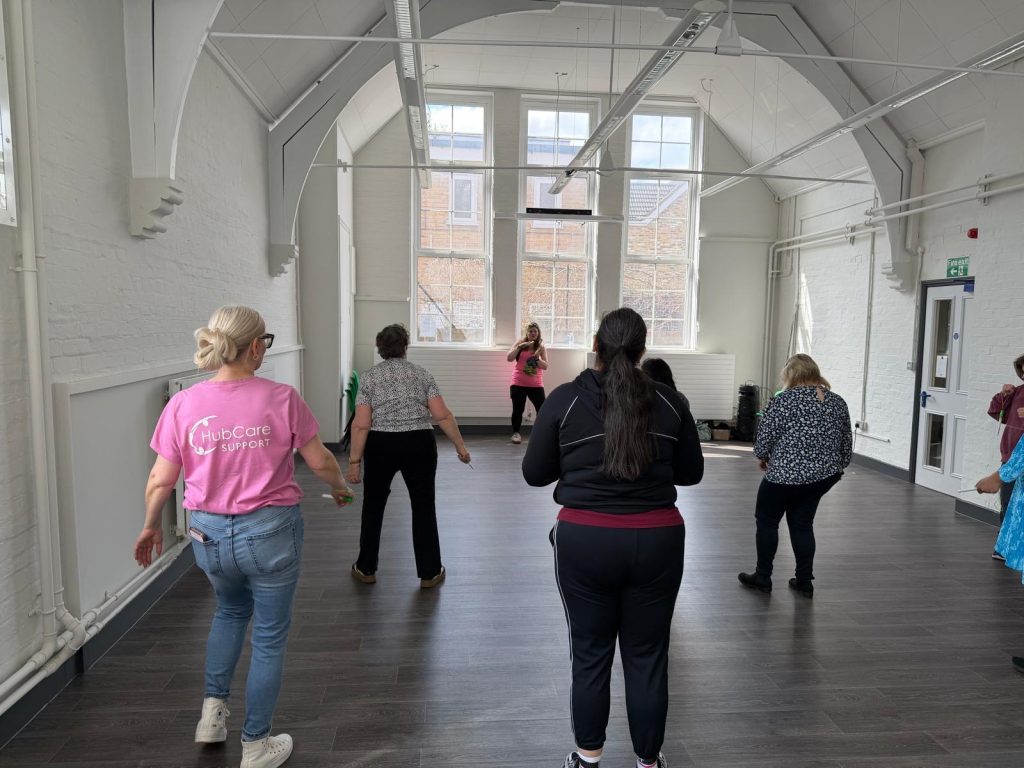 Larissa in her pink hub care support t-shirt joining in with the group who enjoyed a spot of clubbercise.