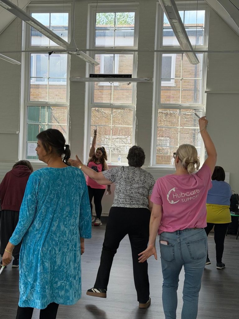 Larissa in her pink hub care support t-shirt joining in with the group who enjoyed a spot of clubbercise.
