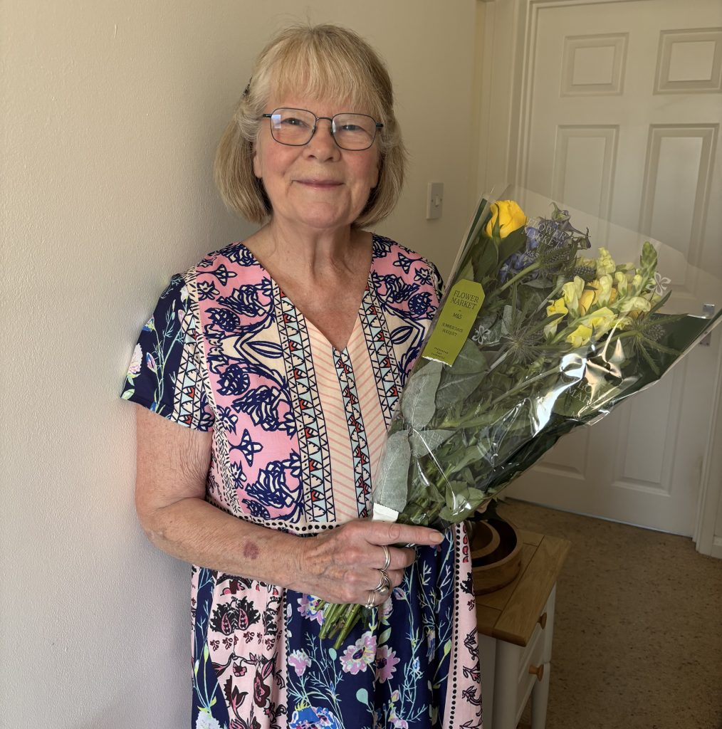 PA Christine with her lovely flowers presented to her